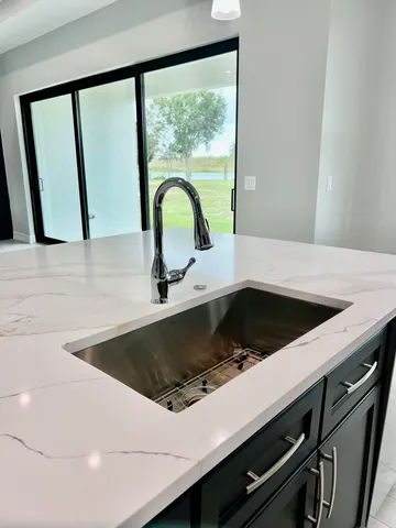 a kitchen with stainless steel appliances a stove and a microwave