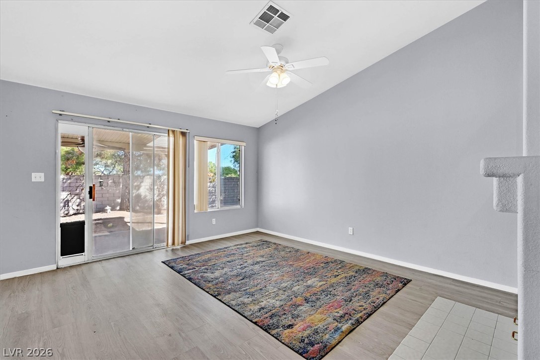8830 Haviland Road Las Vegas, NV 89123 - Photo 9 of 43 Sliding glass doors open to the patio from this spacious living area with durable flooring.
