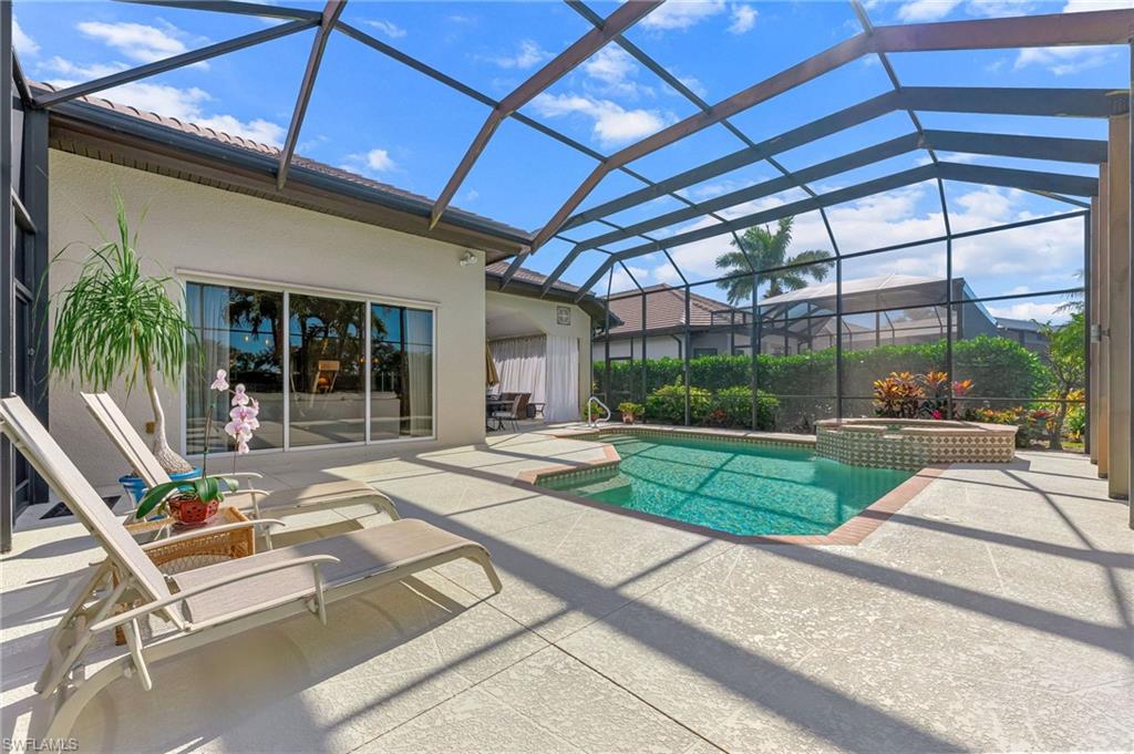 7875 Valencia Court Naples, FL 34113 - Photo 27 of 38 Integrated pool / spa featuring a screened in patio