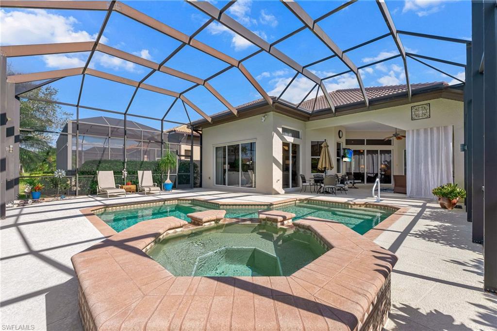 7875 Valencia Court Naples, FL 34113 - Photo 28 of 38 Relaxing pool / spa featuring and beautiful patio area with outdoor dining area