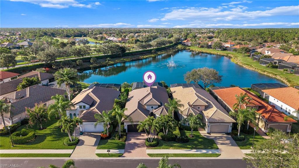 7875 Valencia Court Naples, FL 34113 - Photo 30 of 38 Aerial view of residential area with a large lake view
