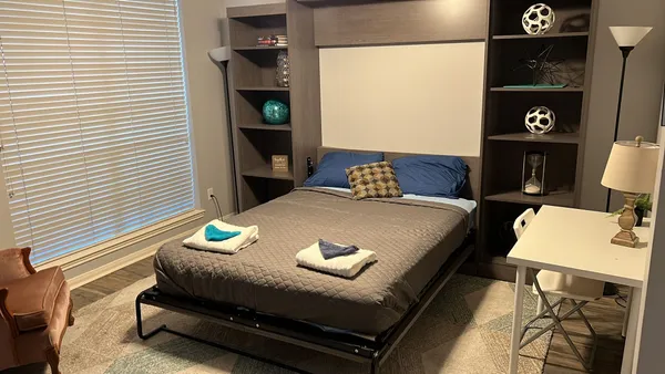 a workspace with furniture and window