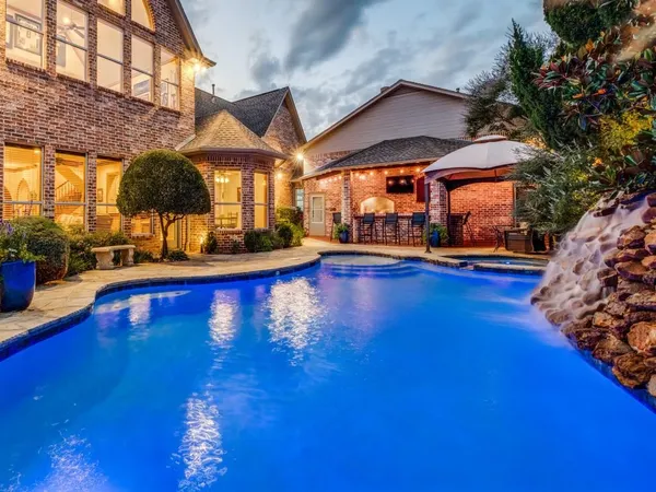 a view of a swimming pool with a patio
