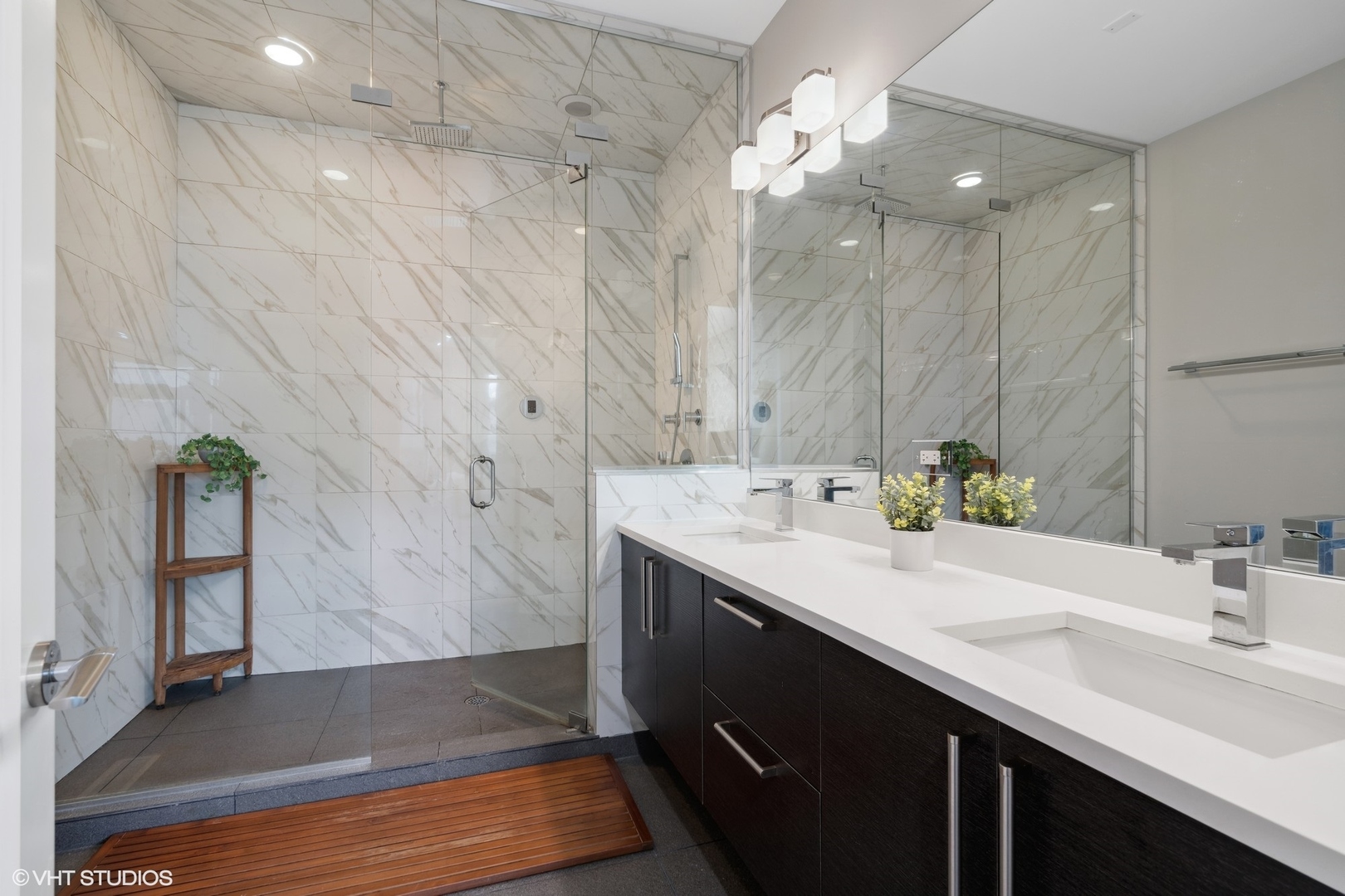 1033 South Racine Avenue, Unit 1S Chicago, IL 60607 - Photo 14 of 29 a bathroom with a sink double vanity and a mirror