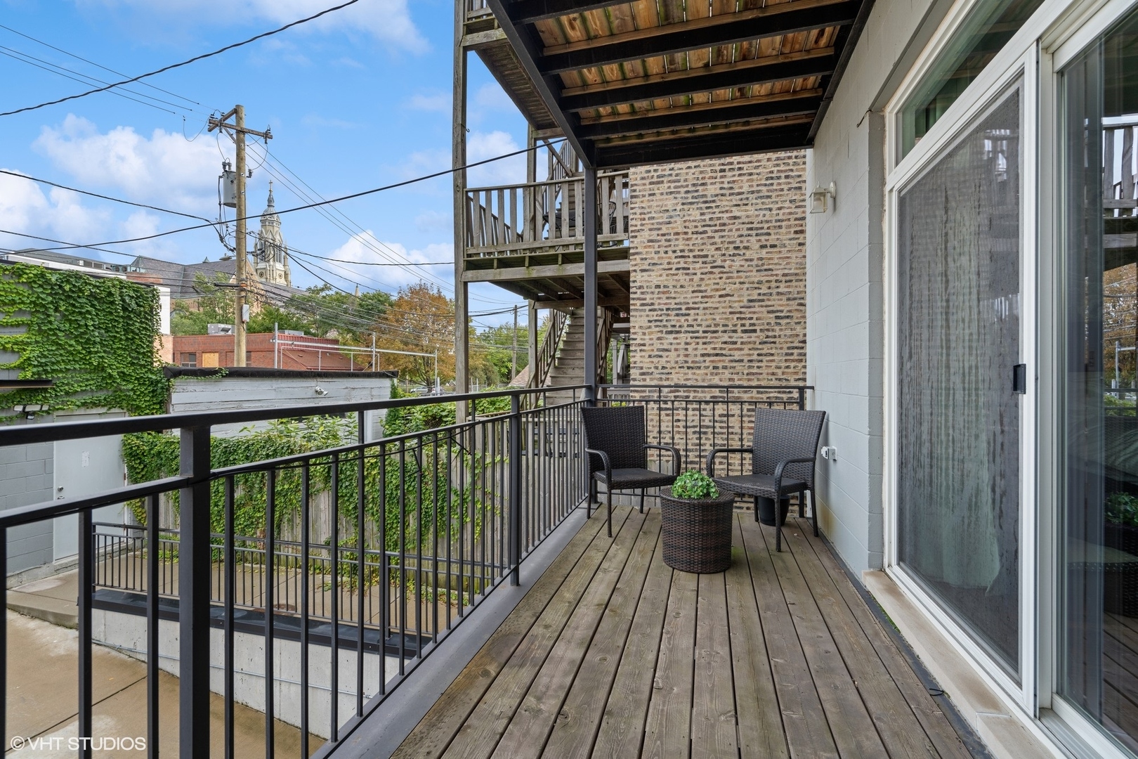1033 South Racine Avenue, Unit 1S Chicago, IL 60607 - Photo 25 of 29 a view of a balcony with chairs
