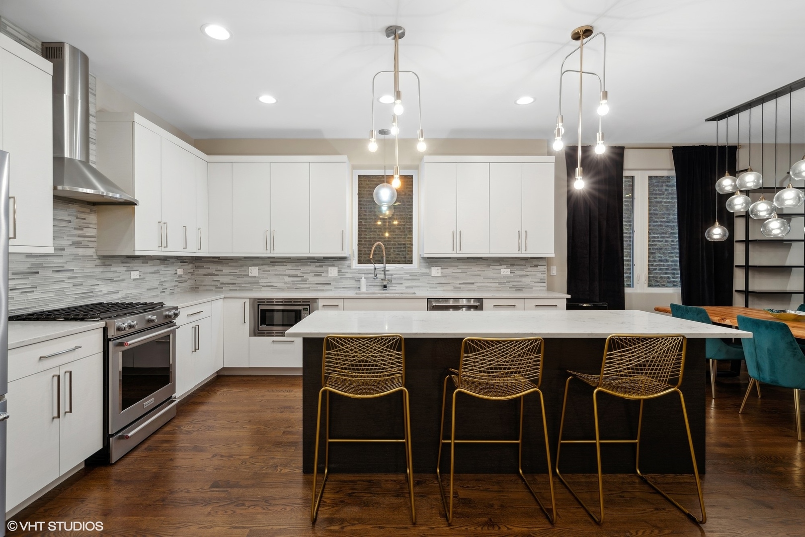 1033 South Racine Avenue, Unit 1S Chicago, IL 60607 - Photo 6 of 29 a kitchen with a dining table chairs wooden floor and stainless steel appliances
