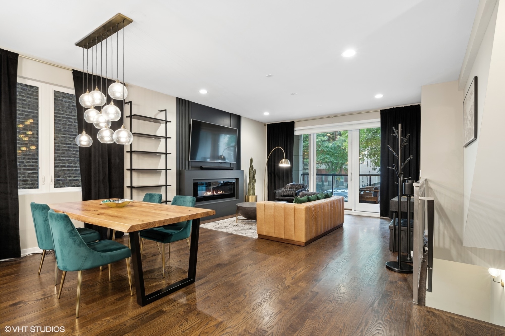 1033 South Racine Avenue, Unit 1S Chicago, IL 60607 - Photo 10 of 29 a living room with fireplace furniture and a flat screen tv