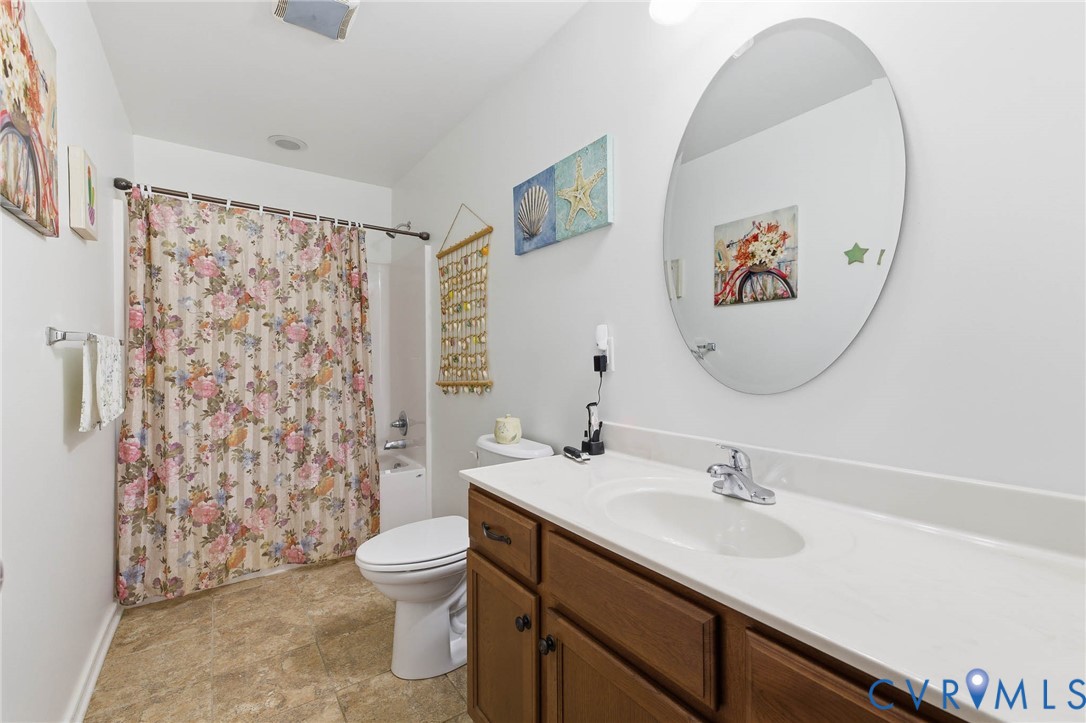 15900 Nobles Road Disputanta, VA 23842 - Photo 12 of 36 Bathroom featuring shower / tub combo and vanity