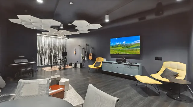 a living room with fireplace furniture and a flat screen tv