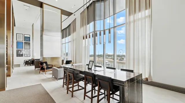 a view of a dining room with furniture and a window