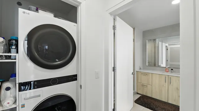 a view of a hallway with washer and dryer