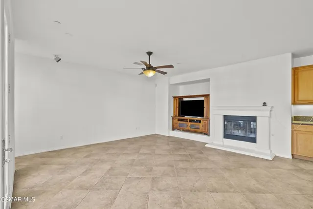 a dining room with furniture and chandelier