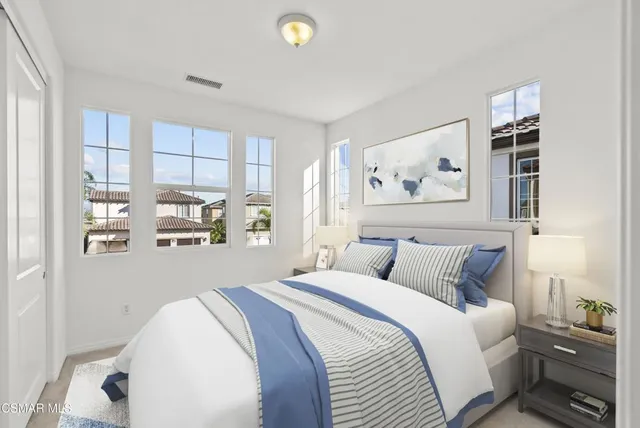 a view of a kitchen with wooden floor and windows