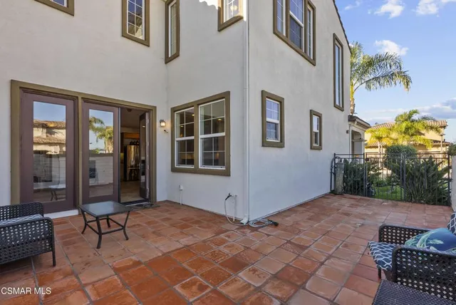 a view of a livingroom with workspace and a couch