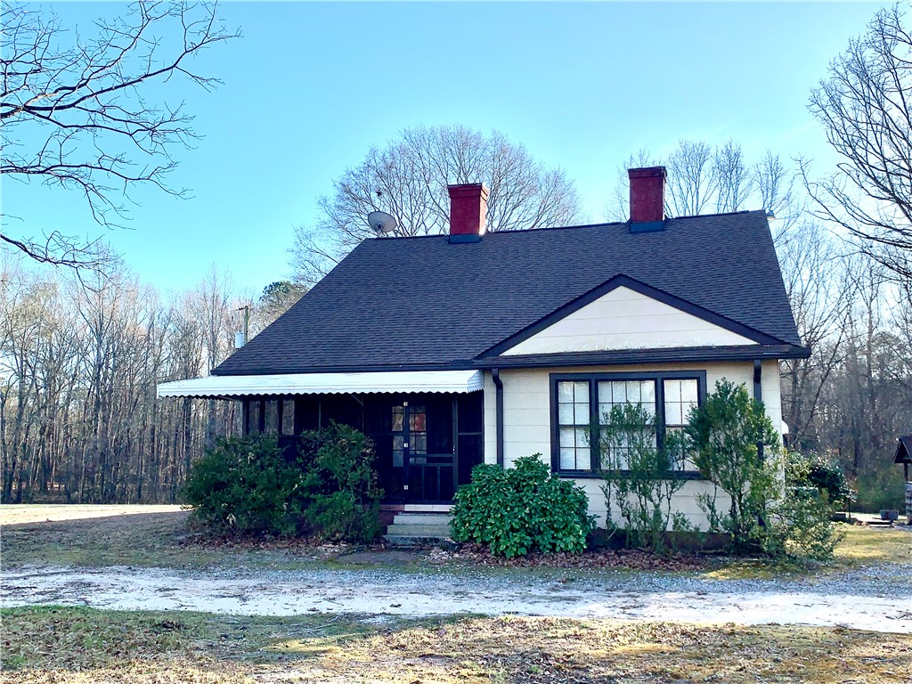 This charming home offers classic appeal and a serene natural setting.