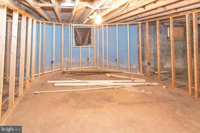 a view of staircase with white walls and a window