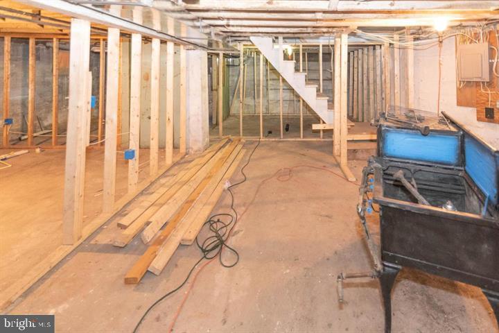 3900 5th Street Baltimore, MD 21225 - Photo 14 of 32 a view of staircase with white walls and a window