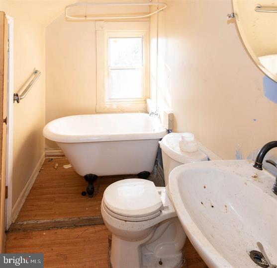 3900 5th Street Baltimore, MD 21225 - Photo 18 of 32 a bathroom with a sink and a toilet