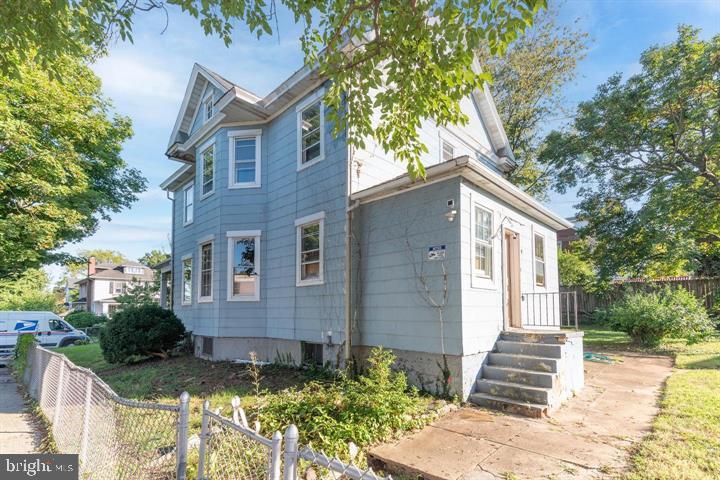 3900 5th Street Baltimore, MD 21225 - Photo 2 of 32 a front view of a house with a garden