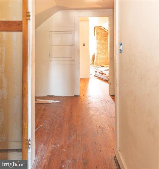 3900 5th Street Baltimore, MD 21225 - Photo 21 of 32 a view of a bathroom with wooden floor and a large window