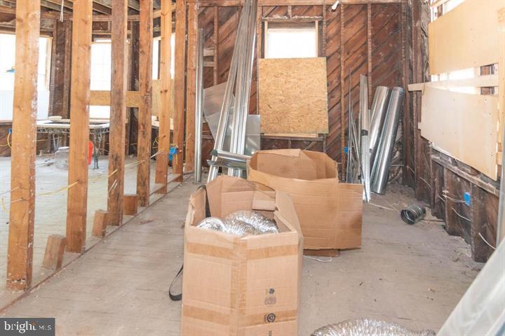 3900 5th Street Baltimore, MD 21225 - Photo 30 of 32 a living room with furniture and a large window