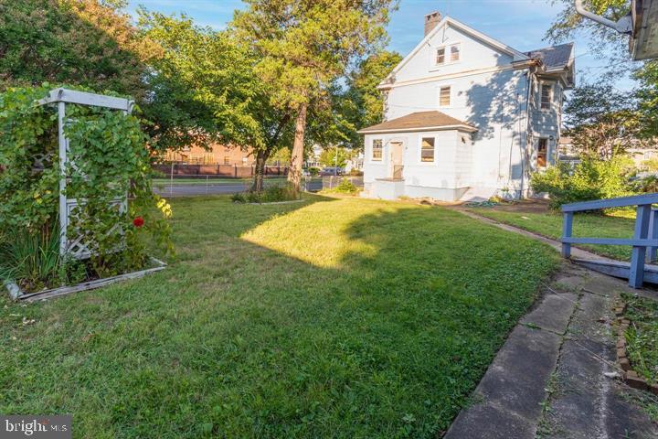 3900 5th Street Baltimore, MD 21225 - Photo 4 of 32 a front view of a house with garden