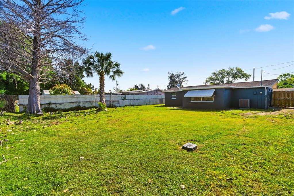 9033 Pegasus Avenue Port Richey, FL 34668 - Photo 42 of 56 a view of an outdoor space and swimming pool