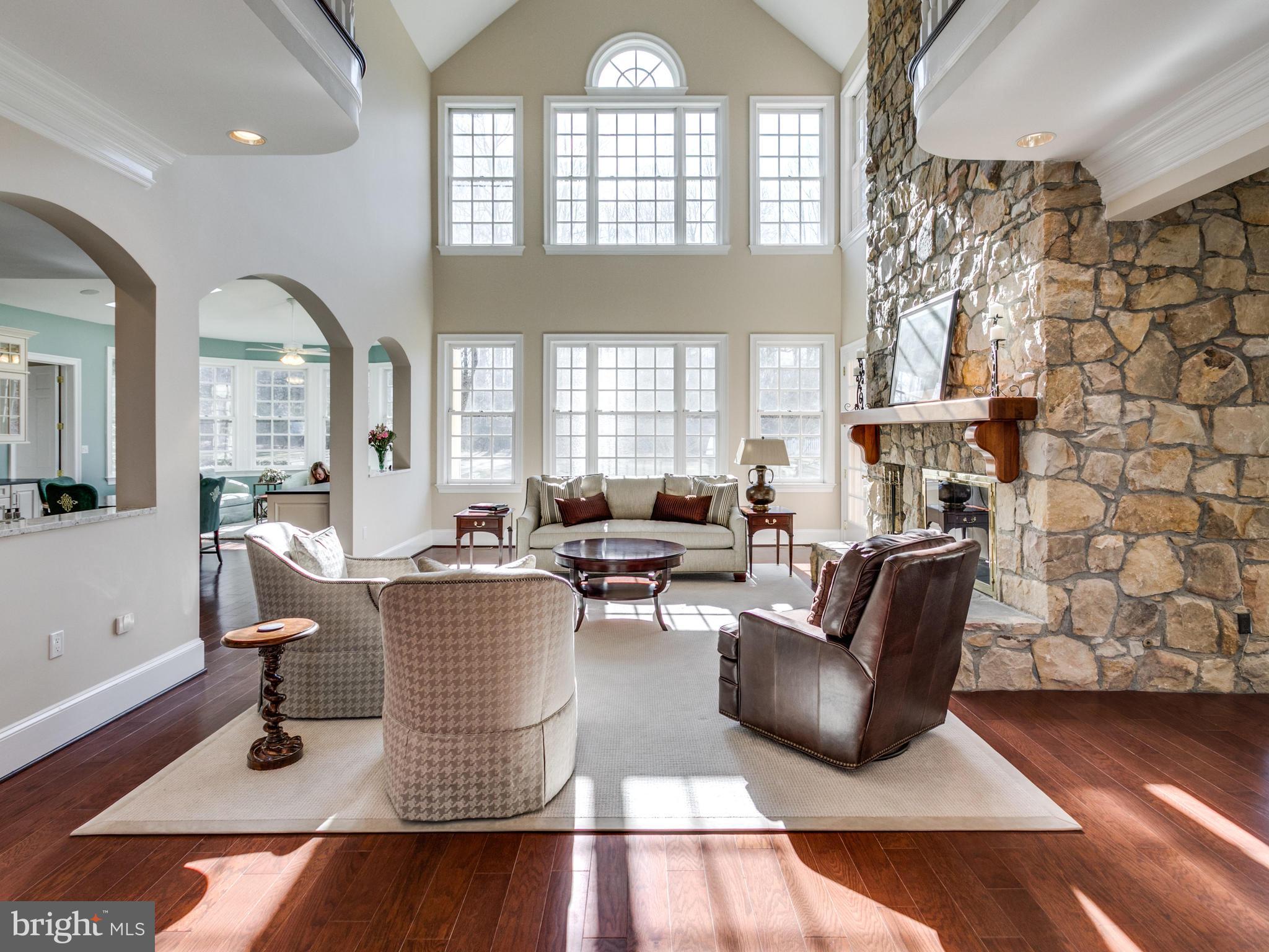 10207 East Hunter Valley Road Vienna, VA 22181 - Photo 3 of 26 SUN-DRENCHED GREAT ROOM W 2 SIDED FIREPLACE