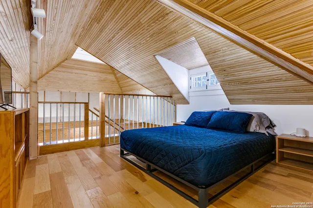 a view of a two chairs in the balcony