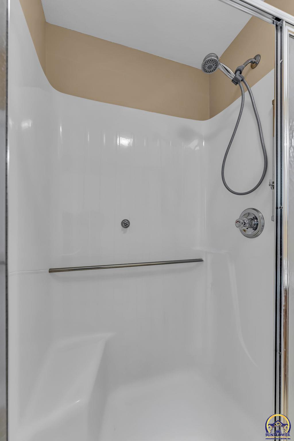 2393 Southwest Honeysuckle Lane Topeka, KS 66614 - Photo 27 of 40 Full Hall Bathroom Shower