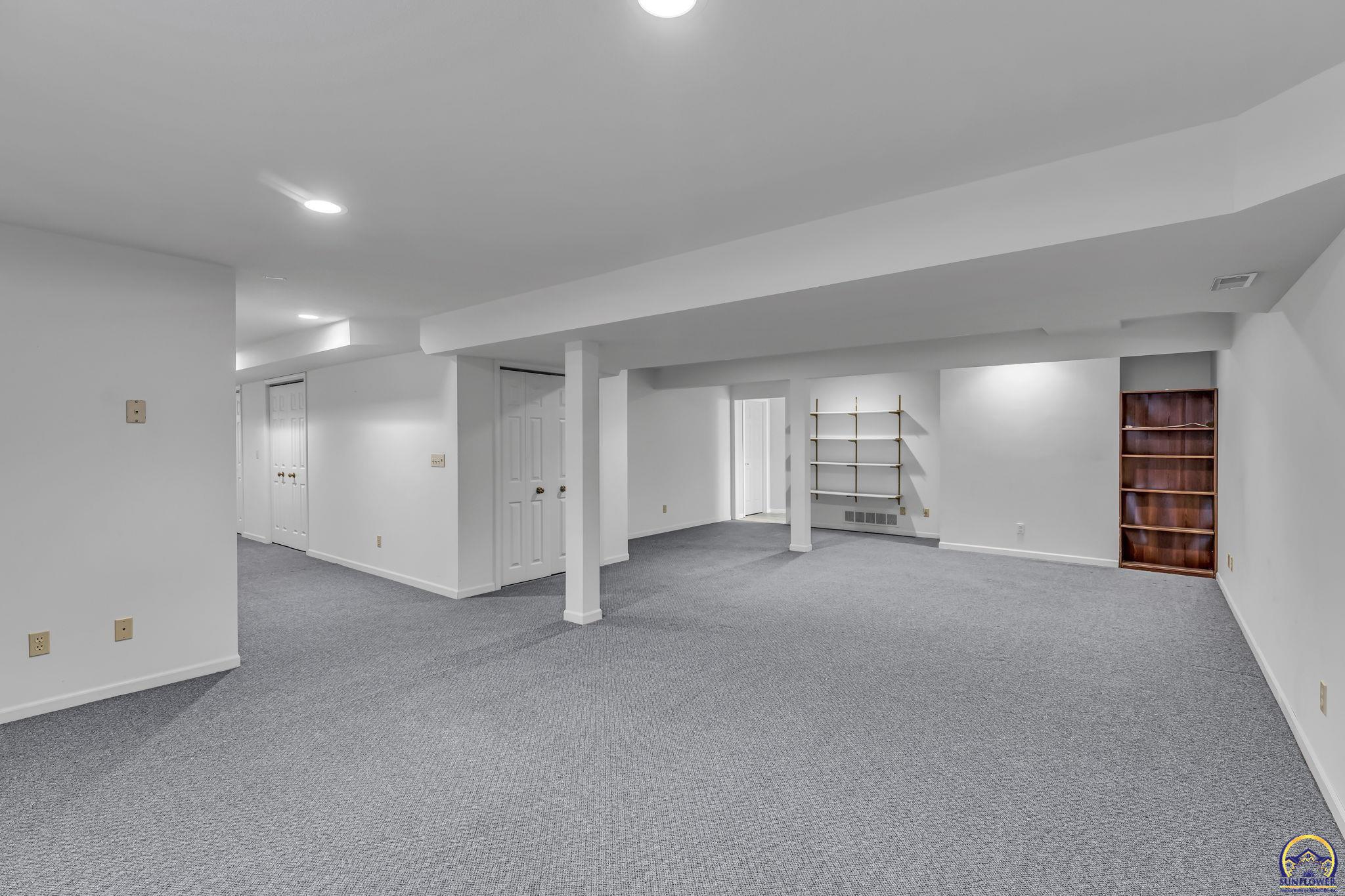 2393 Southwest Honeysuckle Lane Topeka, KS 66614 - Photo 30 of 40 Basement Rec Room