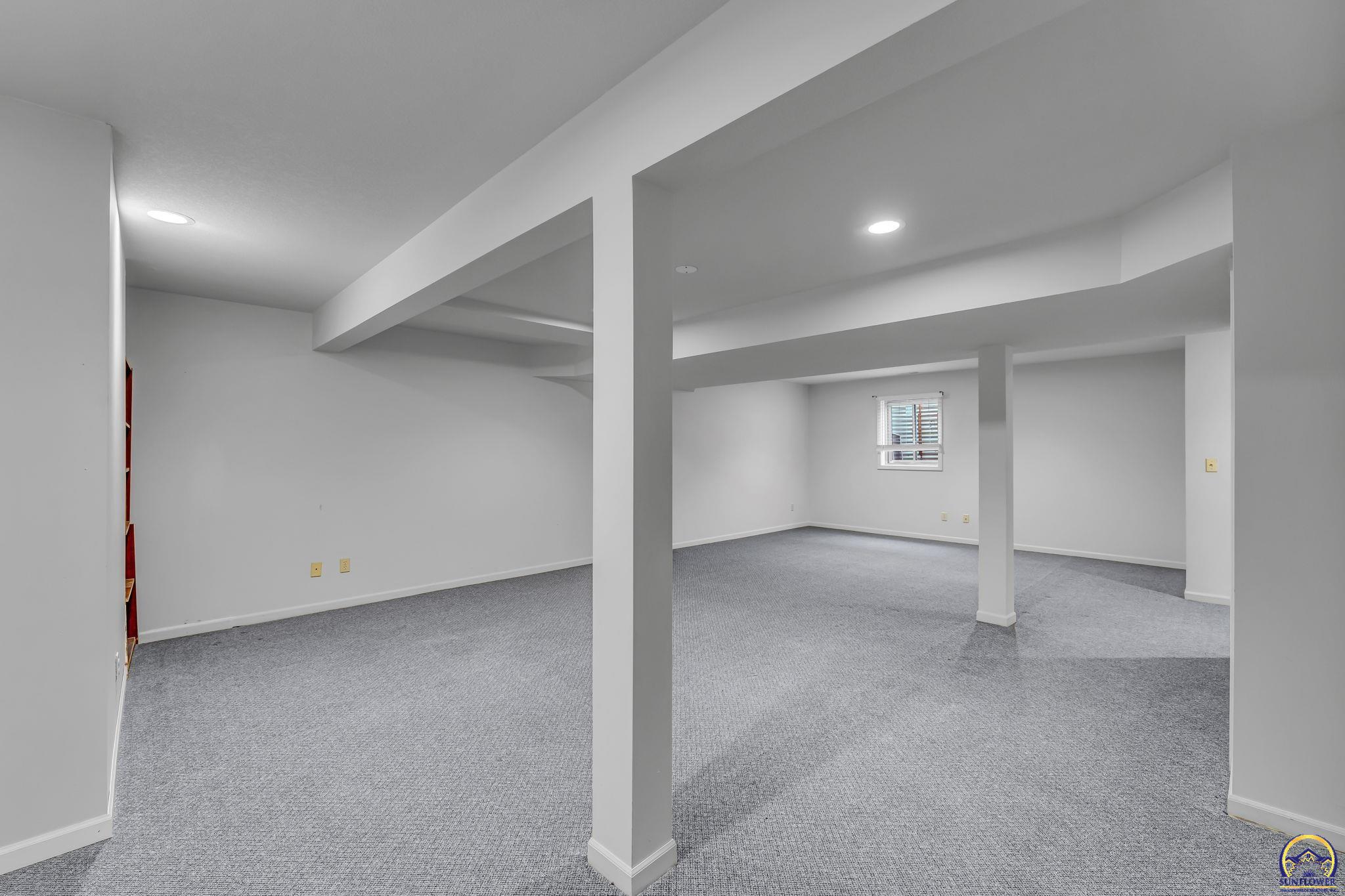 2393 Southwest Honeysuckle Lane Topeka, KS 66614 - Photo 31 of 40 Basement Rec Room