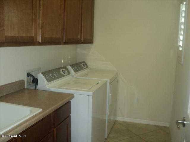 3935 East Rough Rider Road, Unit 1201 Phoenix, AZ 85050 - Photo 15 of 26 Laundry w/Cabinets & Sink