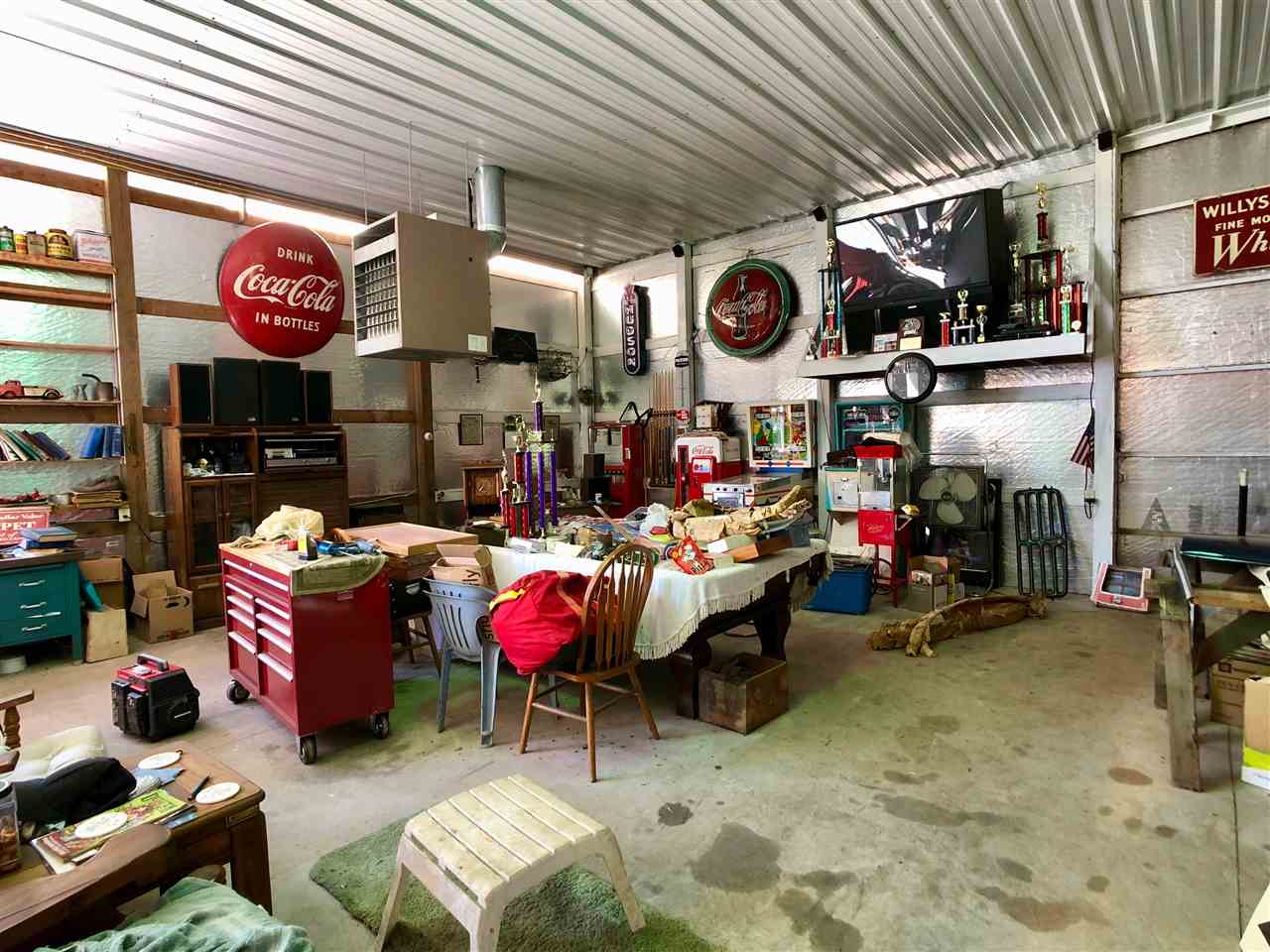 747 Searls Road Amboy, IL 61310 - Photo 19 of 40 a store room with lots of furniture and clutter