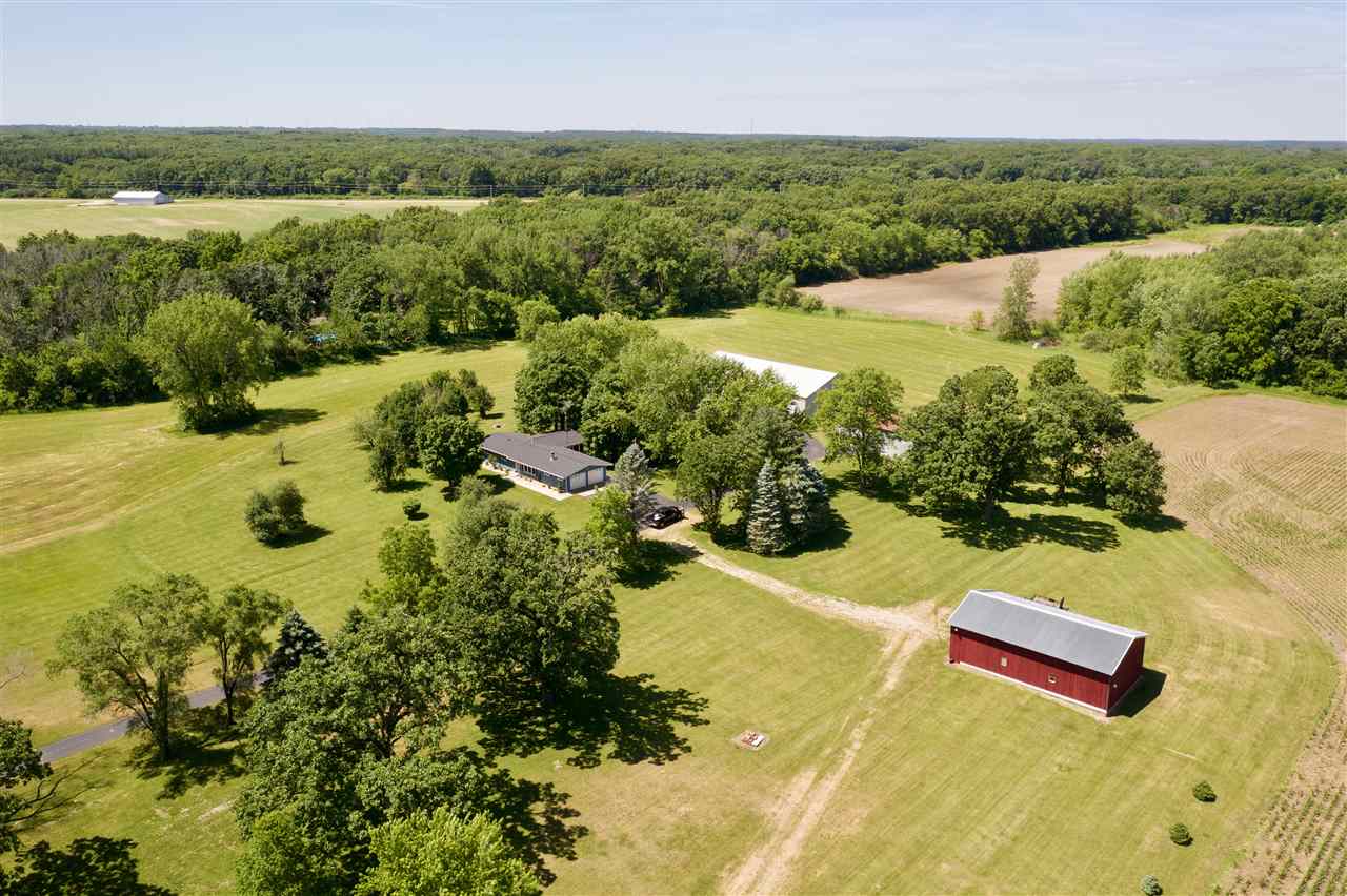 747 Searls Road Amboy, IL 61310 - Photo 20 of 40 a view of a lake with a yard