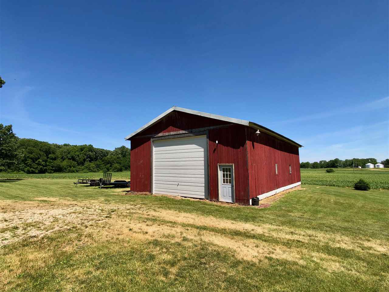 747 Searls Road Amboy, IL 61310 - Photo 21 of 40 a view of a house with a yard