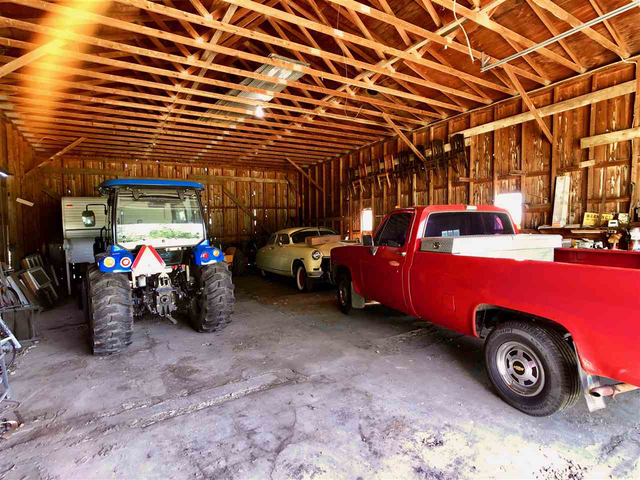 747 Searls Road Amboy, IL 61310 - Photo 22 of 40 a car is parked in a garage