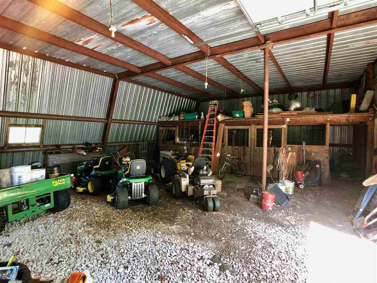 747 Searls Road Amboy, IL 61310 - Photo 27 of 40 a view of a room with gym equipment