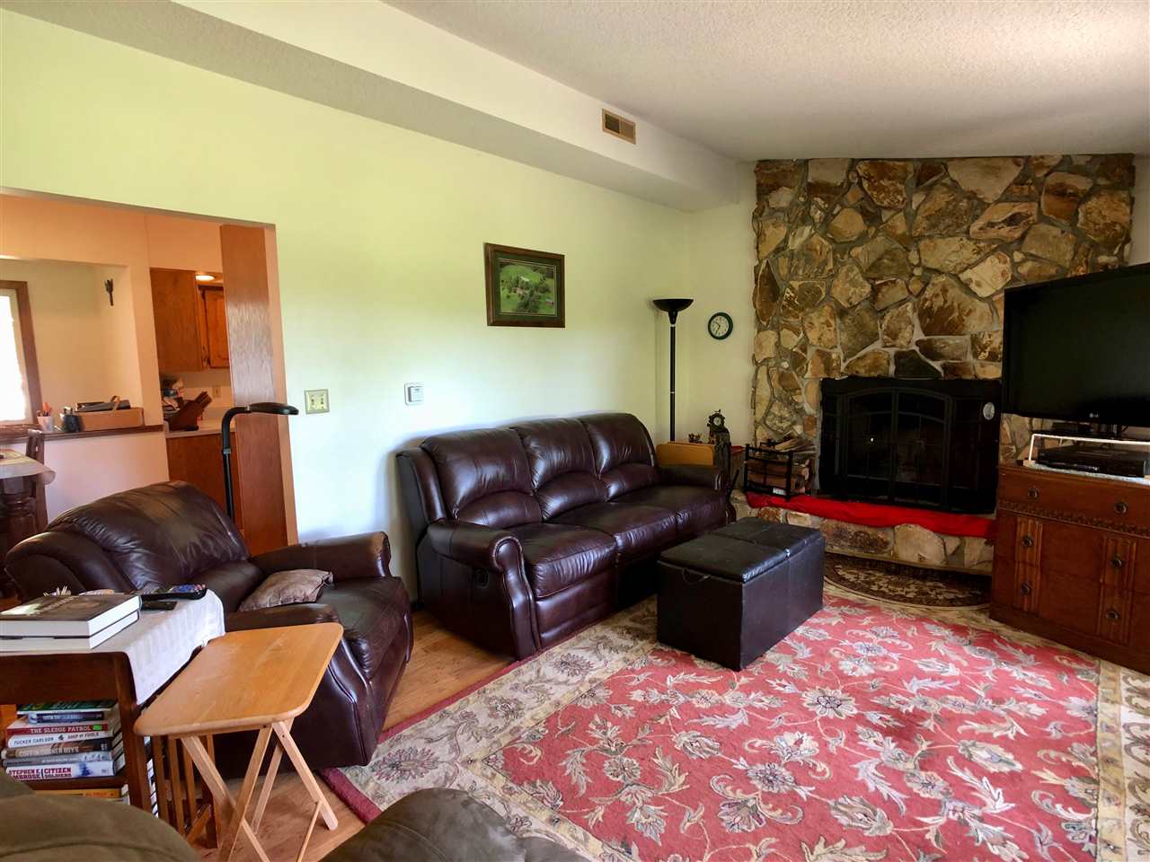 747 Searls Road Amboy, IL 61310 - Photo 29 of 40 a living room with furniture and a flat screen tv