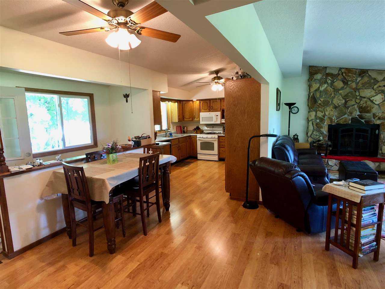 747 Searls Road Amboy, IL 61310 - Photo 35 of 40 a living room with furniture a flat screen tv and a large window