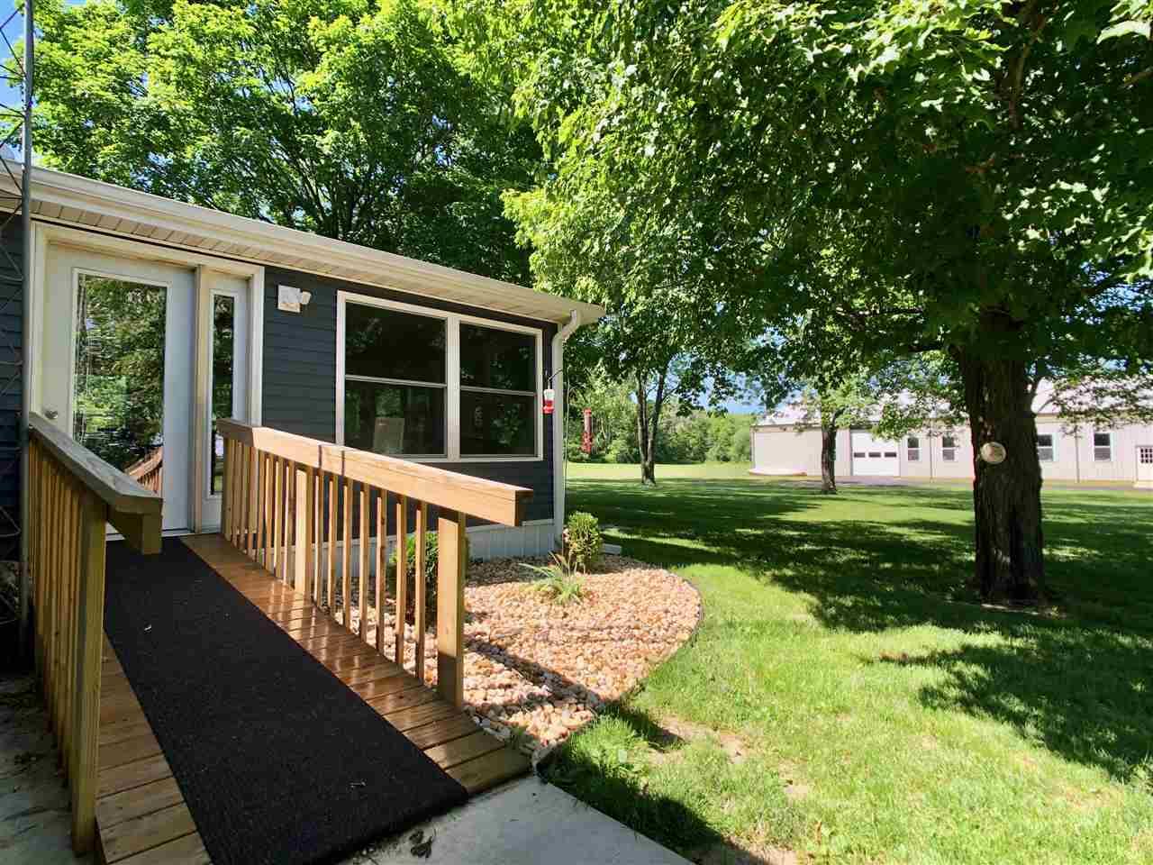 747 Searls Road Amboy, IL 61310 - Photo 39 of 40 a view of a house with backyard and a tree