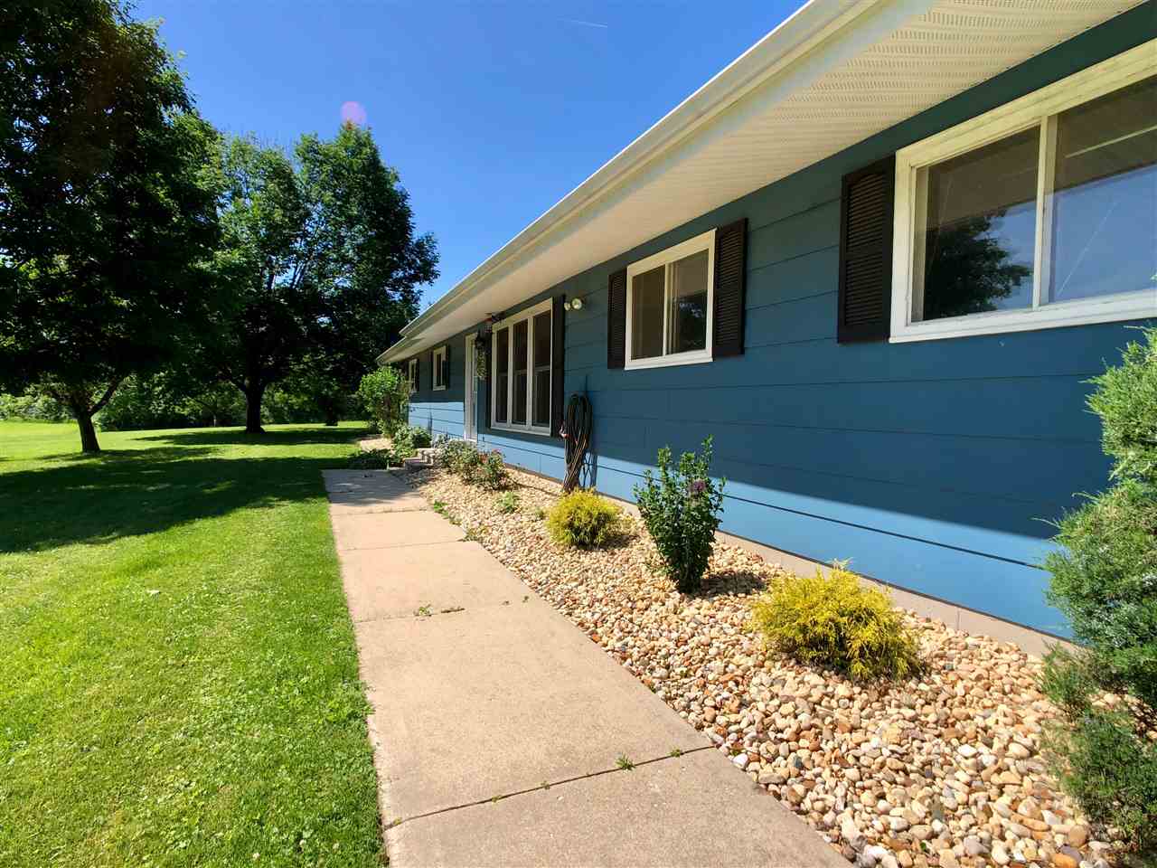 747 Searls Road Amboy, IL 61310 - Photo 5 of 40 a view of a backyard with a garden