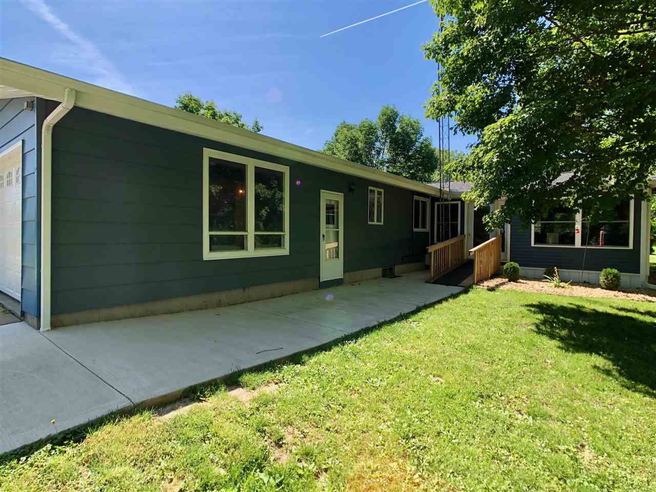 747 Searls Road Amboy, IL 61310 - Photo 10 of 40 a view of a house with backyard and sitting area