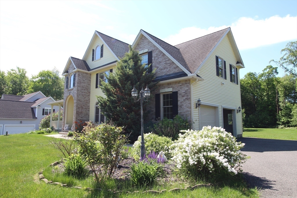 5 Gableview Lane Southwick, MA 01077 - Photo 15 of 41 a front view of house with yard and green space