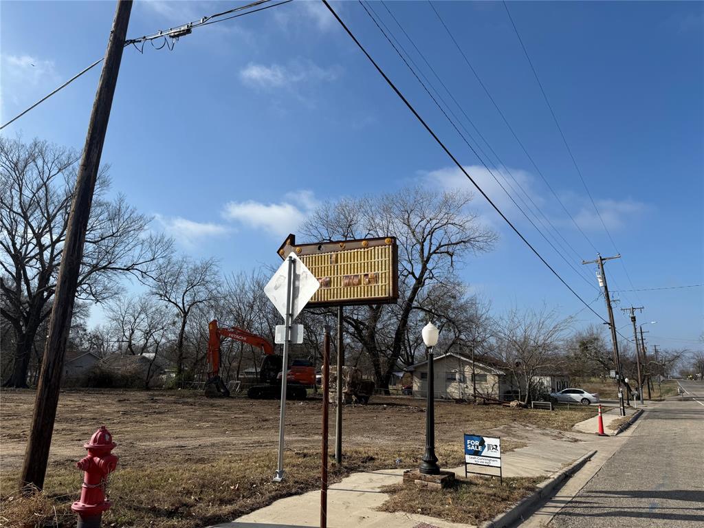 201 West Main Street Wolfe City, TX 75496 - Photo 14 of 14 a view of a street with houses