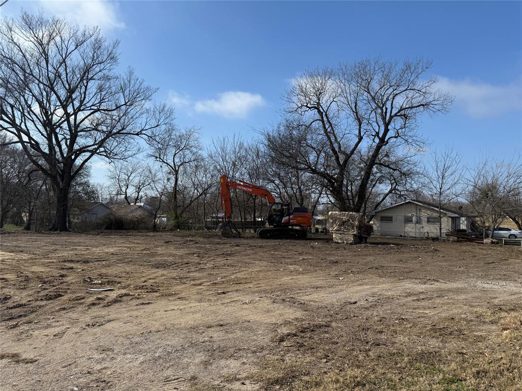 201 West Main Street Wolfe City, TX 75496 - Photo 3 of 14 a view of a house with a snow in the yard