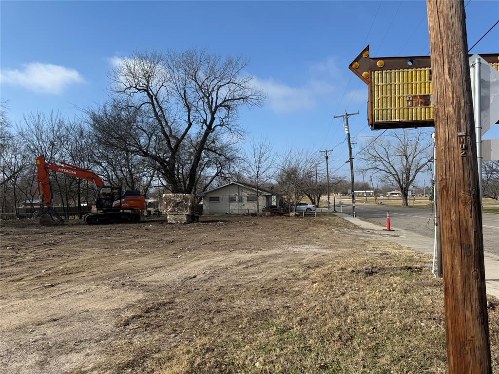 201 West Main Street Wolfe City, TX 75496 - Photo 4 of 14 a street view with residential house