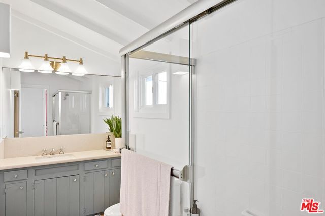 a bathroom with a double vanity sink and mirror