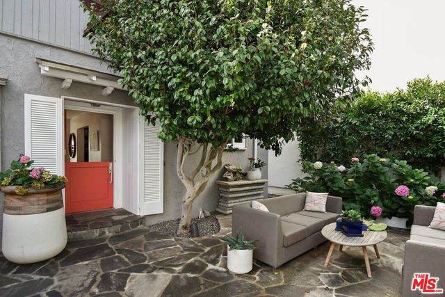 a view of a hallway with entryway and dining room