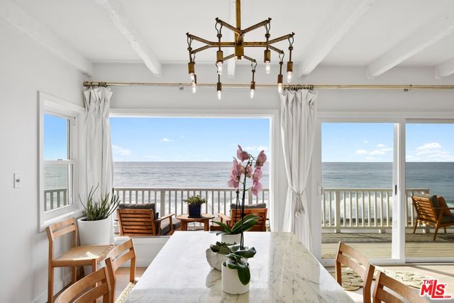 a view of a living room and balcony